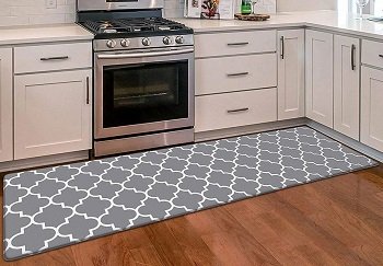 Long kitchen runner mat beside cabinets