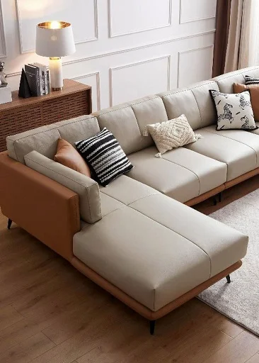 Beige leather sectional sofa with tan wood trim