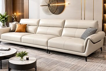 Beige leather sofa with adjustable headrests, black legs