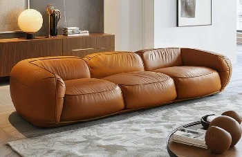 Cognac brown leather 3-seater sofa with rounded puffy design