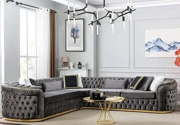 Gray velvet tufted sectional sofa with gold trim