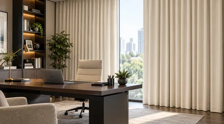 Custom cream blackout curtains in a modern home office